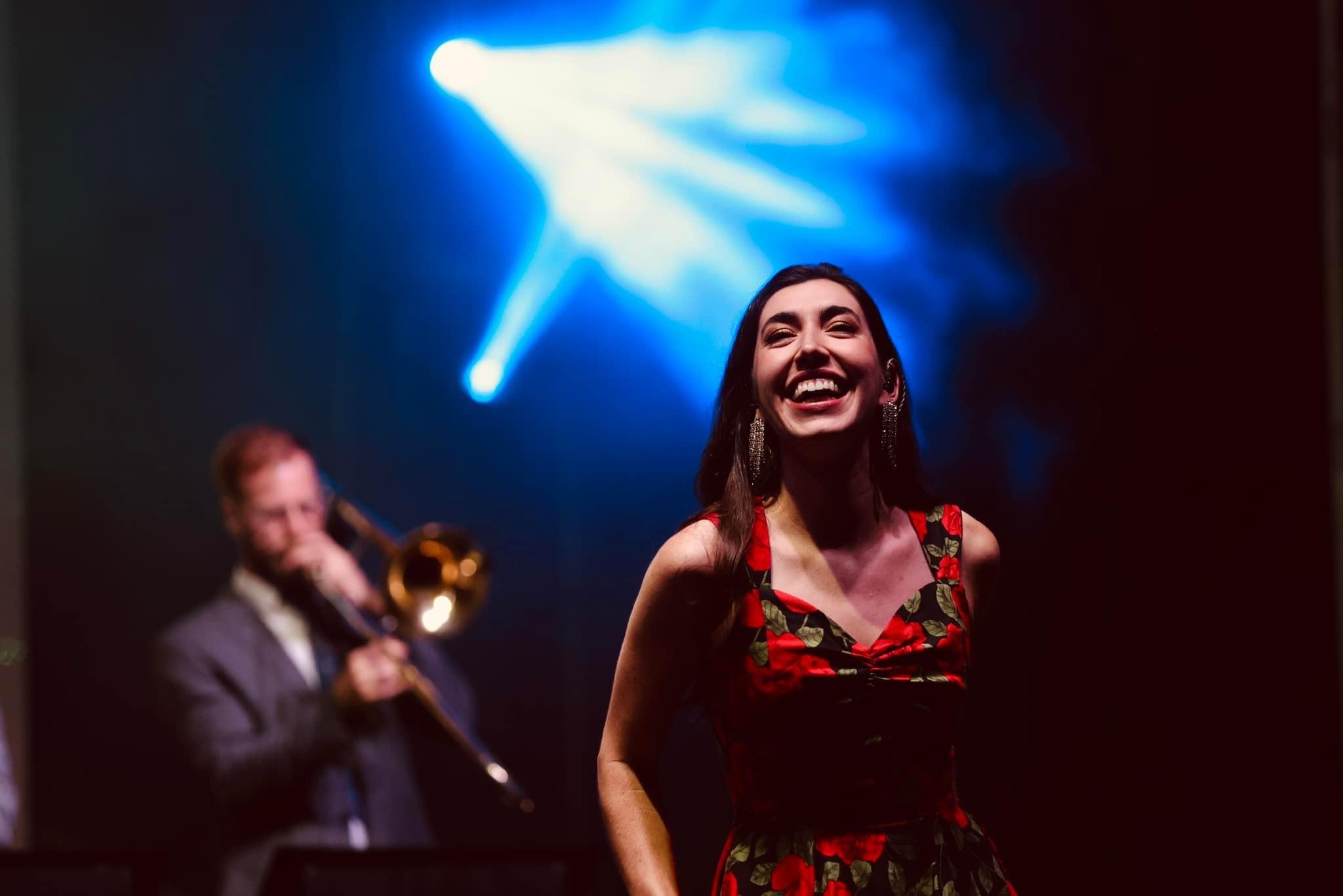 Lauren De Marco laughing on stage