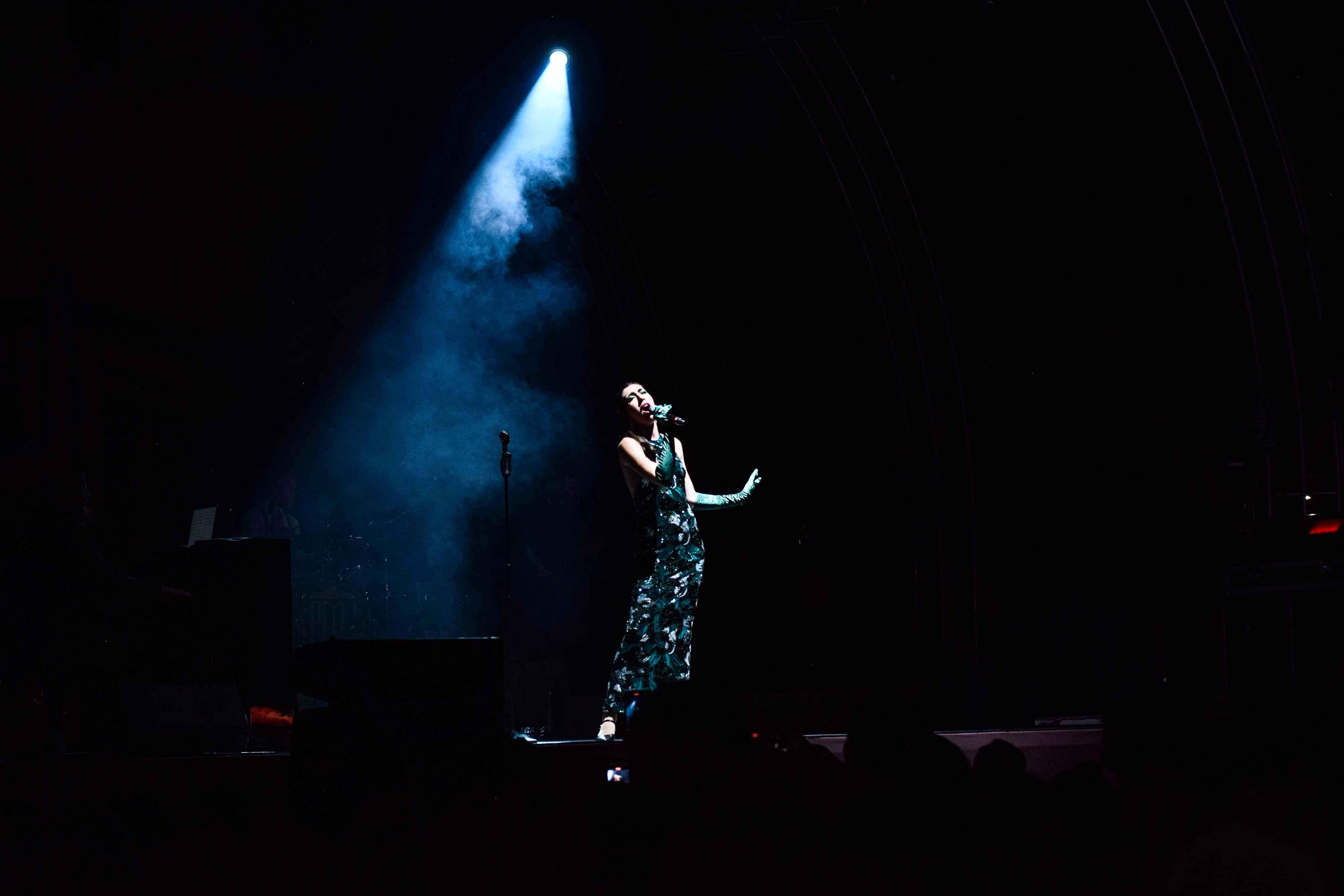 Lauren De Marco under blue spotlight